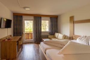 Televiisor ja/või meelelahutuskeskus majutusasutuses Gasthof Stimmersee