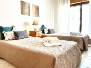 Postel nebo postele na pokoji v ubytování Atlântico View - Beach front - Quarteira