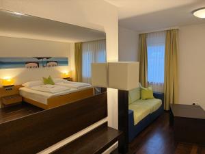 Postel nebo postele na pokoji v ubytování Hotel Germania