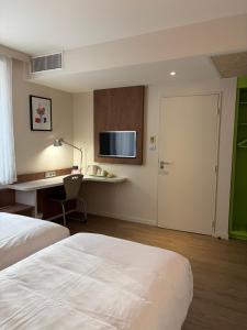 Ένα ή περισσότερα κρεβάτια σε δωμάτιο στο Campanile Annemasse Gare– Genève