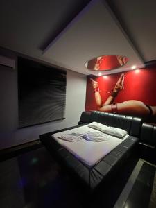 Un pat sau paturi într-o cameră la Motel Vitoria Reggia