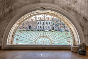 an entry door to a building with a stained glass window at MURANO Suites - Venezia in Murano +36 photos