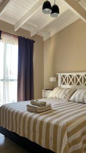 Ένα ή περισσότερα κρεβάτια σε δωμάτιο στο Merlo Centro Aparts