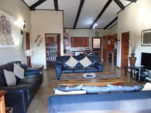 Istumisnurk majutusasutuses Da Gama Lake Cottages - Coral Tree