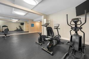 a gym with treadmills and ellipticals in a building at Sleep Inn Indianapolis East in Indianapolis