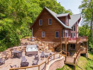 an aerial view of a log home with a patio at A High Country Retreat in Boone