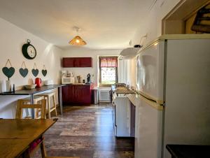 Kuchyň nebo kuchyňský kout v ubytování les piperiens