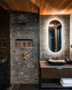 a bathroom with a sink and a mirror at SkyView Igloo Resort in Rovaniemi +82 photos