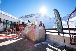 a group of people standing in front of a mountain at Belambra Clubs Tignes Val Claret in Tignes