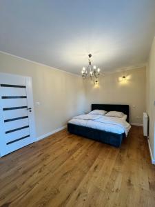 Postel nebo postele na pokoji v ubytování Apartament Zębcowska