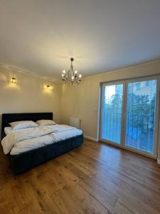Postel nebo postele na pokoji v ubytování Apartament Zębcowska