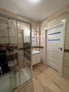 Koupelna v ubytování Apartament Zębcowska + 8 fotografií