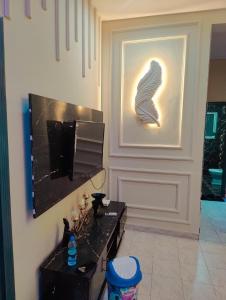 Μια τηλεόραση ή/και κέντρο ψυχαγωγίας στο Cozy Villa's +5 φωτογραφίες