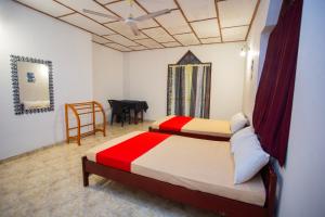 Ένα ή περισσότερα κρεβάτια σε δωμάτιο στο Ransithu Villa