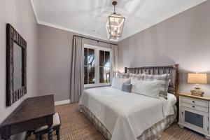 a bedroom with a bed and a desk and a window at Lakeview Landing in Morganton