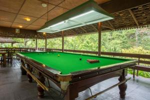 a pool table in the middle of a room at Kangsadarn Resort and Waterfall in Pong Yaeng