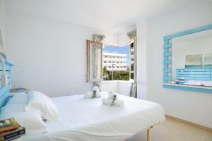 En eller flere senge i et værelse på Apartamento Reganyol by Rentallorca