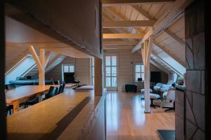 a room with a table and chairs in a house at Lødingen Brygge in Lødingen