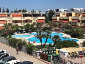 a view of a swimming pool in a resort at Algherocoralapartment in Alghero