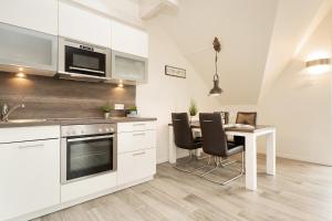 Kuchyň nebo kuchyňský kout v ubytování Bürgermeister-Fox 44a Fehmarn Brise
