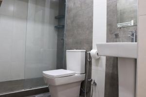a bathroom with a toilet and a sink at Domel Yerevan Moskovyan 28 in Yerevan