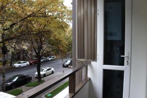 a balcony with a view of a street with cars at Domel Yerevan Moskovyan 28 in Yerevan