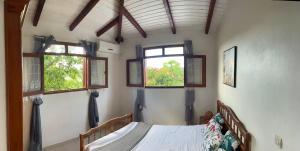 Postel nebo postele na pokoji v ubytování Ciel Caraibe