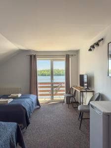 Postel nebo postele na pokoji v ubytování Sielanka nad Junem