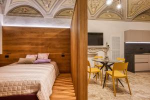 Postel nebo postele na pokoji v ubytování Grigio Perla Mondovi