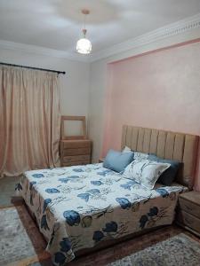 Ένα ή περισσότερα κρεβάτια σε δωμάτιο στο séjour à MARRAKECH