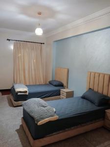 Ένα ή περισσότερα κρεβάτια σε δωμάτιο στο séjour à MARRAKECH