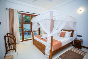 Ένα ή περισσότερα κρεβάτια σε δωμάτιο στο Villa Sun Haven