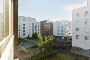 a view from a window of a city with buildings at Stylish, 450 m walk to the Estonian ferry, Free parking and balcony in Helsinki