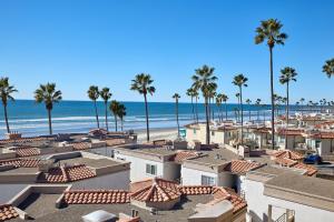 a view of a beach with palm trees and buildings at 501P-12 Spectacular Ocean Views Pet Friendly in Oceanside +25 photos