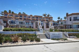 a building with a sign that reads sun watch at 501P-12 Spectacular Ocean Views Pet Friendly in Oceanside