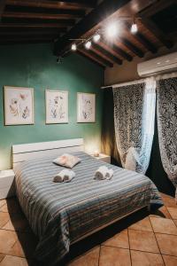 Postel nebo postele na pokoji v ubytování Cecil - La casa del Pucci