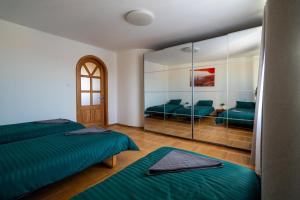 Ένα ή περισσότερα κρεβάτια σε δωμάτιο στο Julias's House