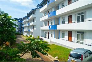 a car parked in front of a building at Rest Point 7 in Veyangoda