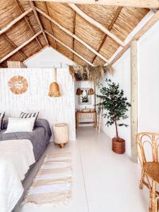 a bedroom with a bed and a table at Tribu Eco Beach in Francisco Álvarez +56 photos