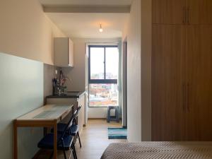 Ένα ή περισσότερα κρεβάτια σε δωμάτιο στο Studio Memphis in El Prado