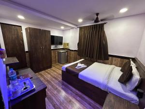 Μια τηλεόραση ή/και κέντρο ψυχαγωγίας στο Lucky Service Apartments - Near BKC