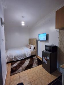 Ένα ή περισσότερα κρεβάτια σε δωμάτιο στο Fine Stay Classy Studio Lower Kabete