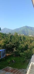 a view of a hill with mountains in the background at Mountainshade Home in Kathmandu +33 photos