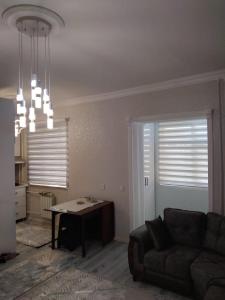 Posezení v ubytování City Center Apartment + 3 fotografie