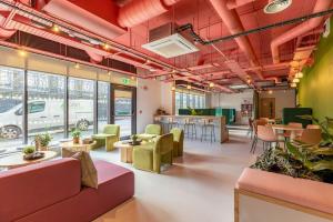 an office with red ceilings and tables and chairs at For Students Only The Brook in Bath in Bath
