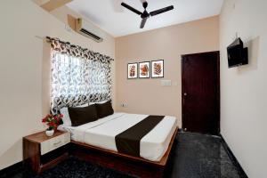 Postel nebo postele na pokoji v ubytování Collection O Kammasandra Gate Bus Terminal Formerly Riches Inn + 21 fotografií