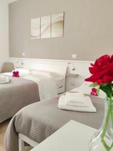 Postel nebo postele na pokoji v ubytování B&B Alle porte del centro