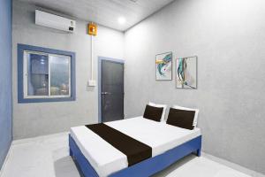 Ένα ή περισσότερα κρεβάτια σε δωμάτιο στο Hotel O The Lotas Gardan