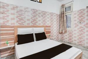 Ένα ή περισσότερα κρεβάτια σε δωμάτιο στο Hotel O prream view +18 φωτογραφίες