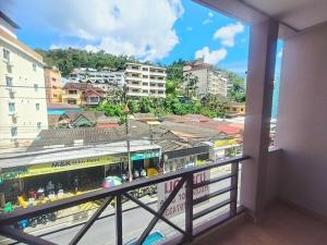 a balcony with a view of a city at Bursa Hotel Patong in Patong Beach